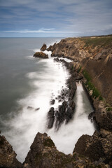 long exposure vertical view of rocky and wild coast on the Altlantic Ocean