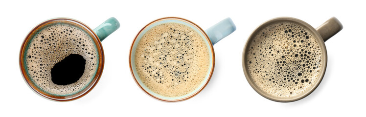 Set of mugs with aromatic hot coffee on white background, top view. Banner design