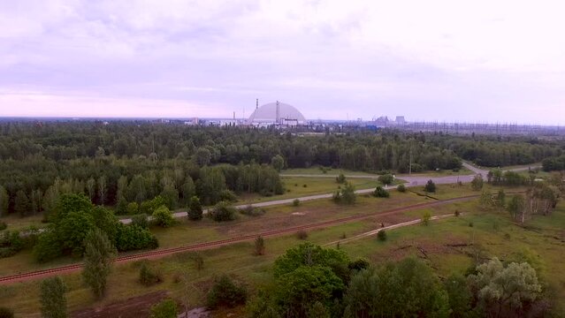 Aerial view New Safe Confinement. Chernobyl nuclear power plant. Chernobyl red forest