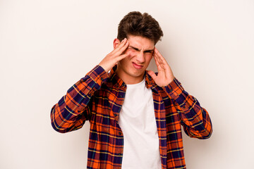 Young caucasian man isolated on white background touching temples and having headache.