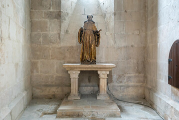 the statue of Saint Stephen in one of the chapels of the church of the Alcobaca monastery - obrazy, fototapety, plakaty
