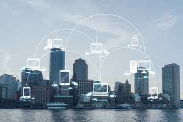 Panorama city view of Boston Harbor at day time, Massachusetts. Buildings of financial downtown. Glowing Social media icons. The concept of networking and establishing new connections between people