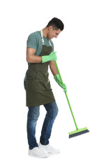 Man with green broom on white background