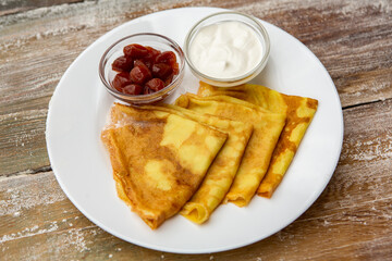 Ideal breakfast with pancakes and eggs. 