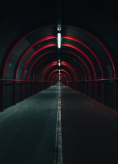 Cinematic Vertical shot of Glasgow tunnel with neon lights at night creating a post-apocalyptic mood