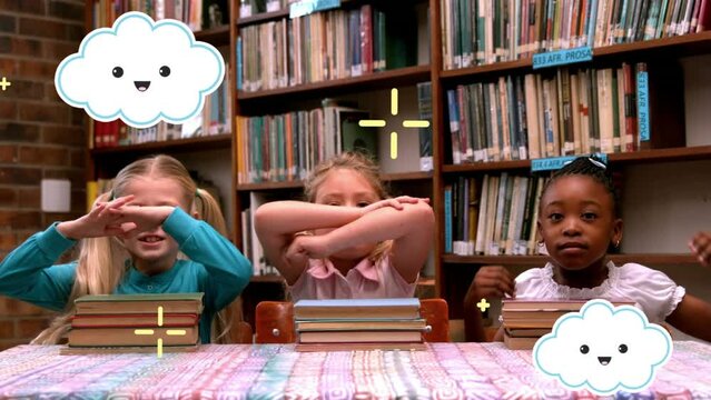 Animation of clouds and markers moving over happy school children with books