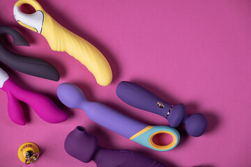 Sex toys. Many vibrators on a bright background. Useful for adult and sex shop