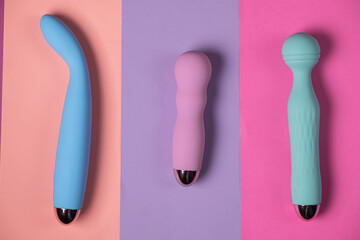 Sex toys. Many vibrators on a bright background. Useful for adult and sex shop