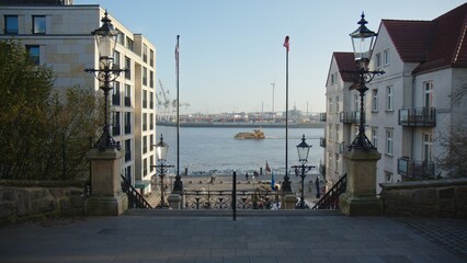 Port of Hamburg, River Elbe, with the Koehlbrandtreppe in the foreground. Ferry passing by.