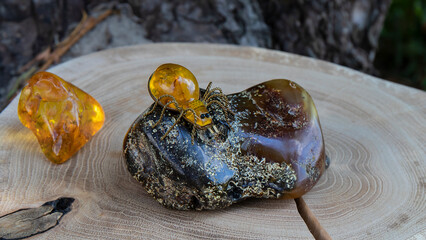 Yellow amber bug on a green Baltic amber stone.  Amber jewelry.