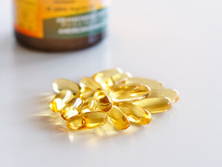 Closeup of a capsule with omega 3 oil