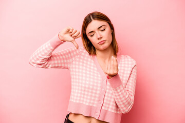 Young caucasian woman isolated on pink background showing that she has no money.
