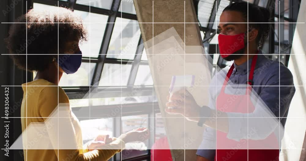 Poster animation of digital interface and graph over diverse couple in face masks at work using technology