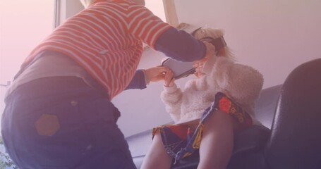 Animation of smiling caucasian siblings playing with vr headset - Powered by Adobe