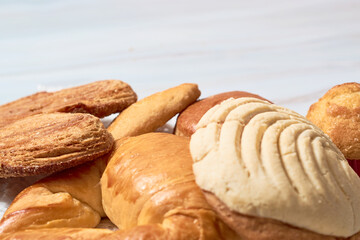Variety of Mexican sweet bread on marble table