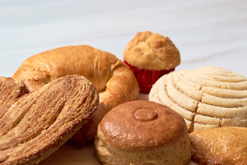 Variety of Mexican sweet bread on marble table