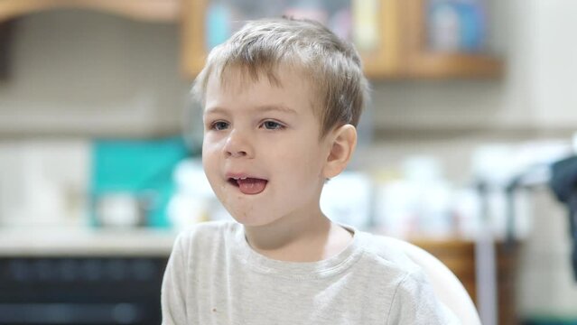 Boy Watching TV And Wiping His Nose