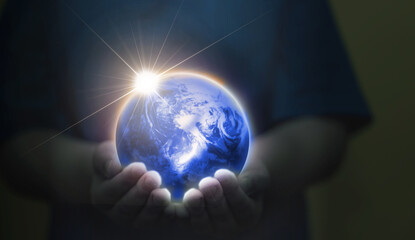hands hold glowing globe for world protection