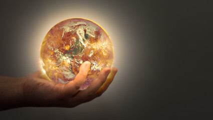 hand hold hot globe for global warming