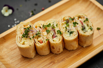 Snacks of pita bread with cheese and tomatoes. Variety mix of small sandwiches on dark background. Photo for restaurant menu