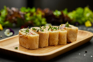 Snacks of pita bread with cheese and tomatoes. Variety mix of small sandwiches on dark background. Photo for restaurant menu