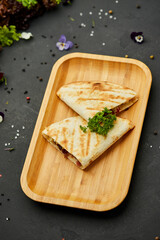 Tasty snacks Tortilla with vegetables and meat. Photo for restaurant menu. Mexican Taco food