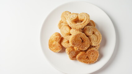Palmier biscuits - french cookies made of puff pastry also called palm leaves, elephant ears or french hearts