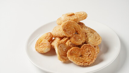 Palmier biscuits - french cookies made of puff pastry also called palm leaves, elephant ears or french hearts
