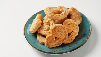 Palmier biscuits - french cookies made of puff pastry also called palm leaves, elephant ears or french hearts