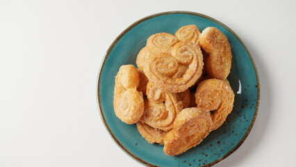 Palmier biscuits - french cookies made of puff pastry also called palm leaves, elephant ears or french hearts