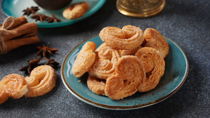 Palmier biscuits - french cookies made of puff pastry also called palm leaves, elephant ears or french hearts - obrazy, fototapety, plakaty