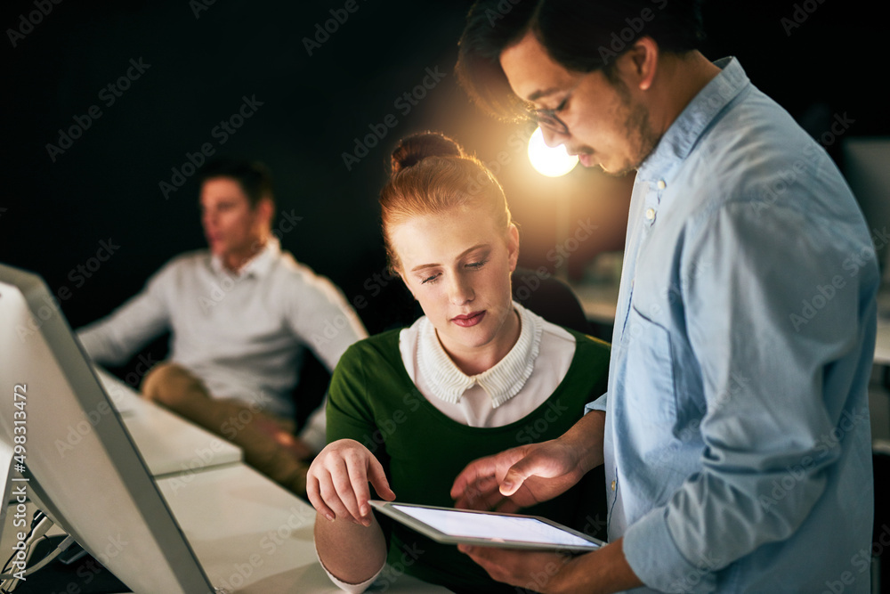 Poster lets take a new approach to this task. shot of businesspeople working together on a digital tablet i