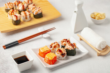 Japanese food sushi roll set with soy sauce on the table