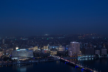 Fototapeta na wymiar CAIRO, EGYPT - DECEMBER 29, 2021: Beautiful view of the center of Cairo and Zamalek island from the Cairo Tower in Cairo, Egypt