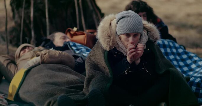 Refugee In Forest Feeling Cold During Russian-Ukrainian War.