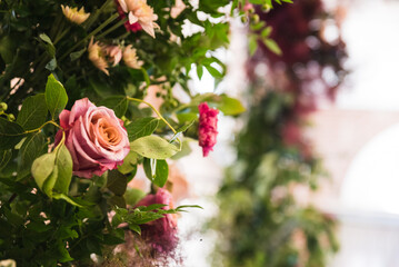 close up of rose and flower arrangement 