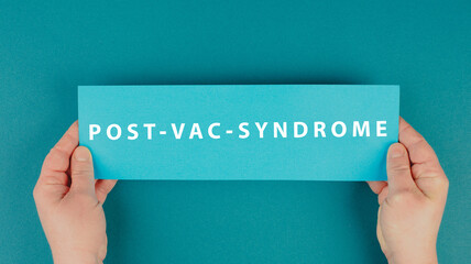 The words post vac syndrome are standing on a paper, covid-19 vaccine damage and side effects, pandemic jab - obrazy, fototapety, plakaty