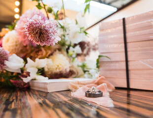 wedding rings and flower bouquet 