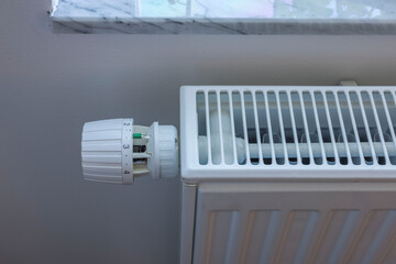 Close up view of thermostat knob on heating radiator in apartment. Sweden.