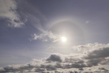 Beautiful view of sun breaking through cloudy spring sky.