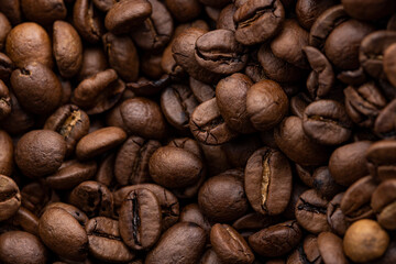 A macro shot of a pile of coffee beans