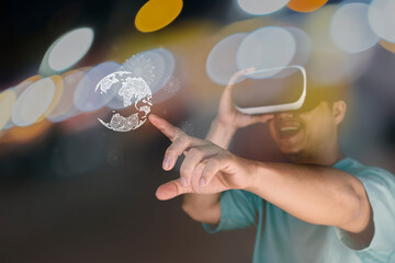 Double exposure, man wearing virtual reality goggles, night city. Smartphone using with VR goggles headset.