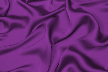 Purple silk or satin luxury fabric texture can use as abstract background.