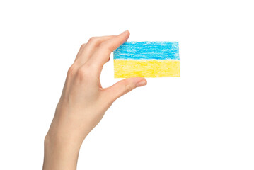 Ukrainian flag in woman hands isolated on a white background.