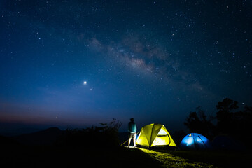 milky way with meteor star and hiking tent in summer time