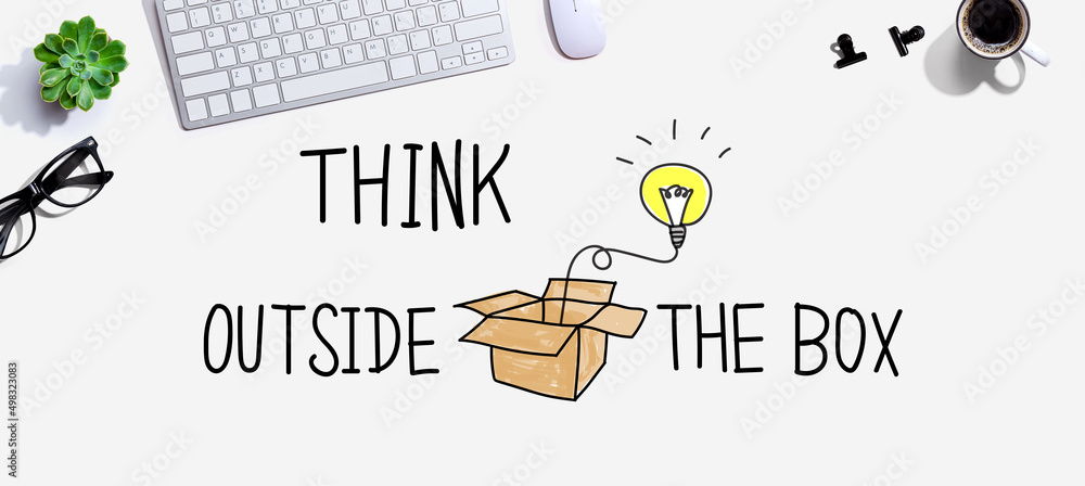 Poster think outside the box with a computer keyboard and a mouse