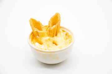 corn chips in a cup with souce isolated on white background,