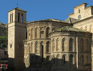 Fototapeta na wymiar Church of Santiago del Arrabal. Historic city of Toledo. Spain. View of the apse and bell tower. Islamic Mudejar art of the 13 century.
