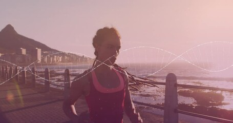 Animation of dna strand over biracial woman running on promenade - Powered by Adobe