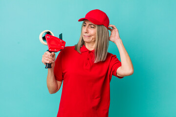 senior gray hair woman feeling puzzled and confused, scratching head. packer employee concept